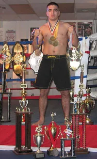 Marcos Avellan with his medals, trophies, and championship belts